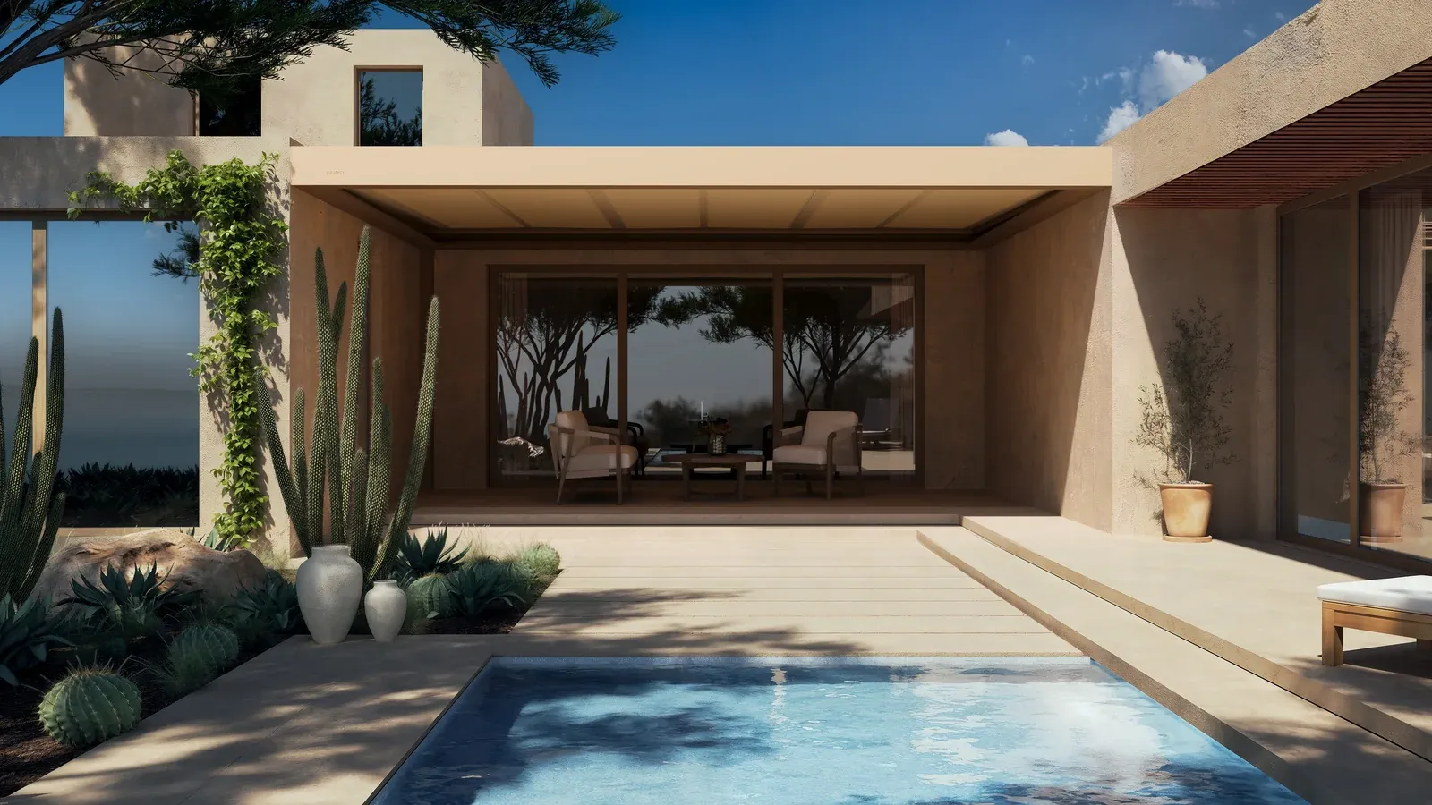 Überdachte Terrasse einer modernen Villa mit Pool und Sitzbereich, umgeben von Kakteen und Garten